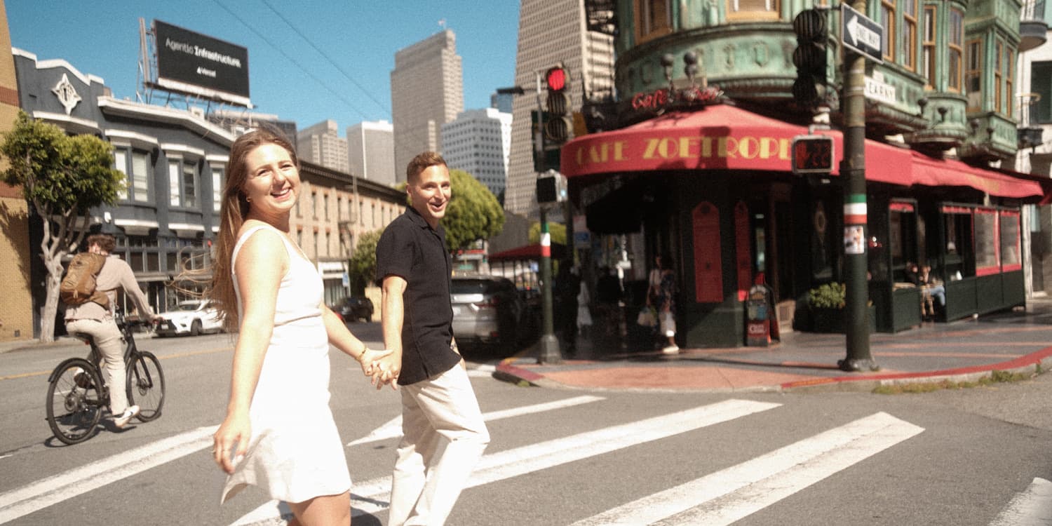 Thomas and Victoria crossing a San Francisco street together near Cafe Zoetrope.